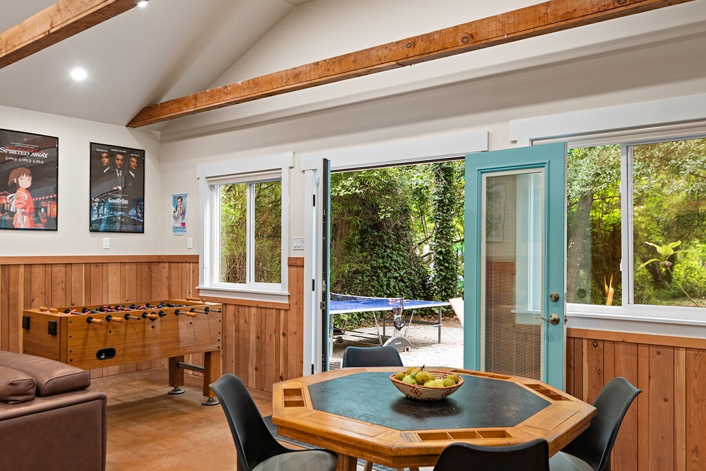 Double doors open to the outdoor lounge and game area - connecting the two game "rooms."