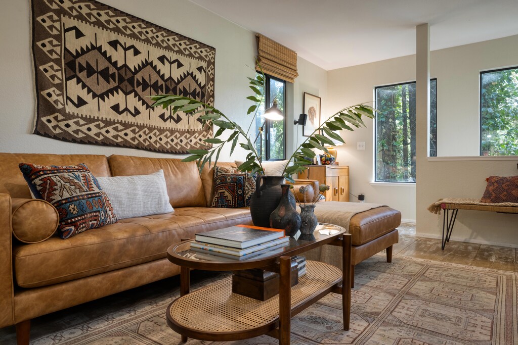 Open, bright living room filled with a rotating selection of original art and hand-picked decor..