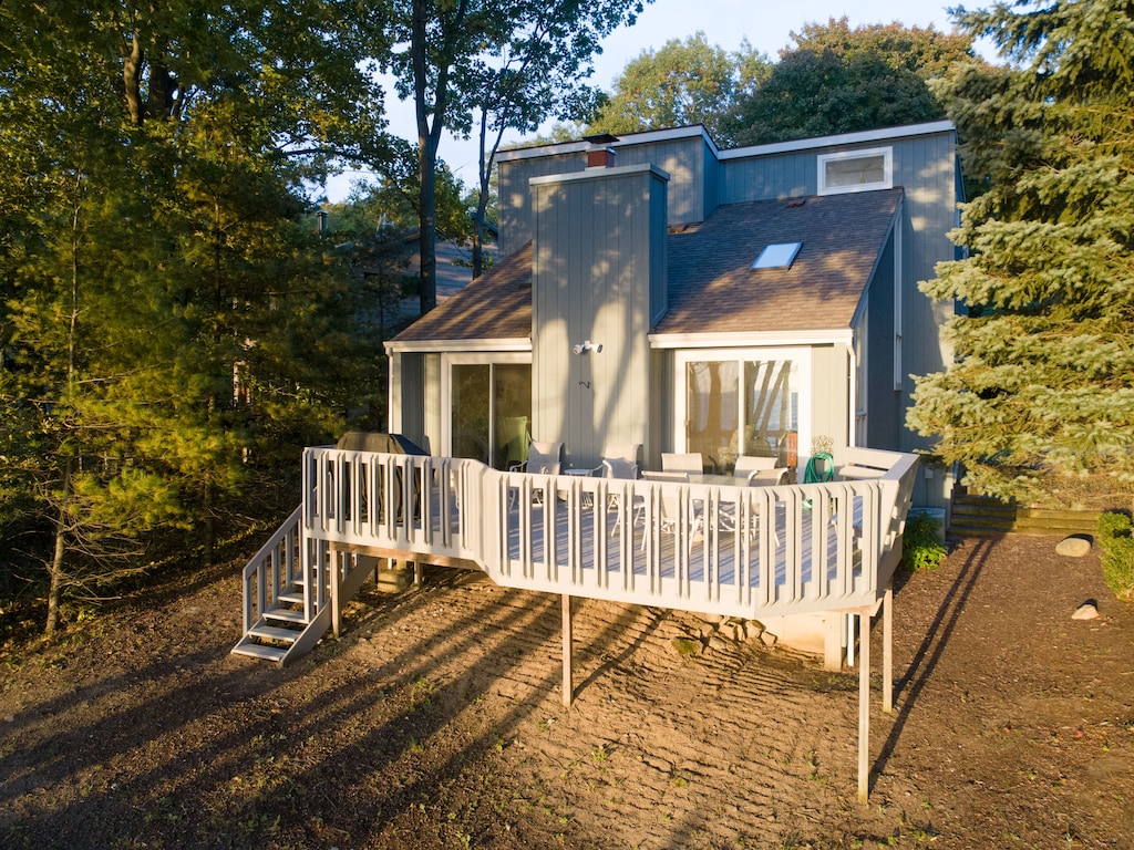 Deck off living area has gas grill and is designed for family meals while enjoying the view of Lake Michigan.