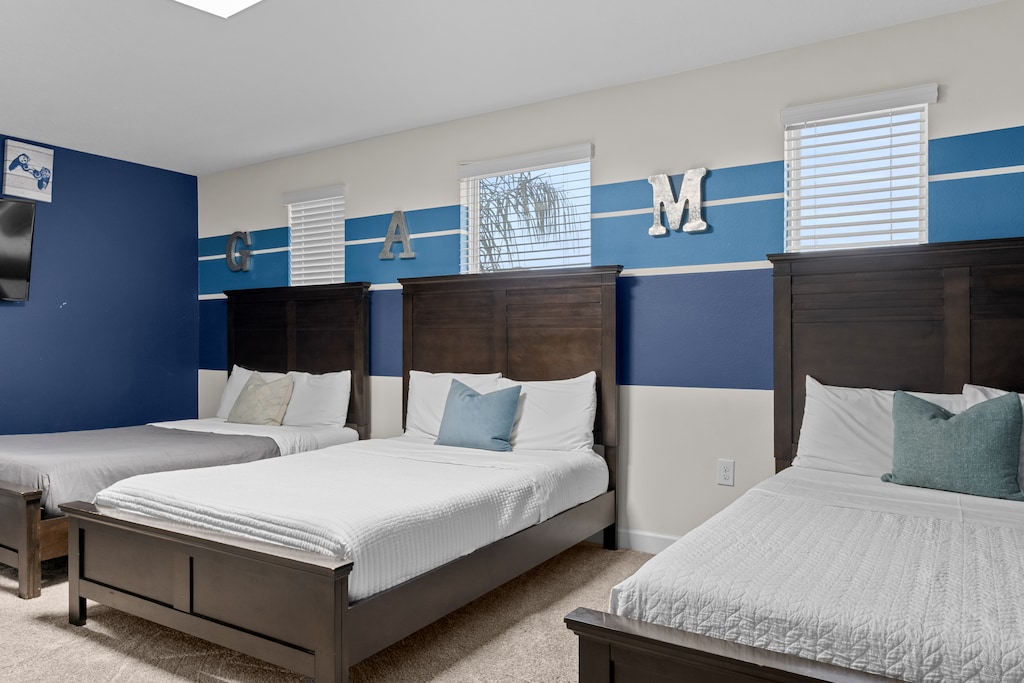 Sleep soundly in your spacious room with three comfortable beds, each topped with soft linens and accent pillows for the perfect night's rest.