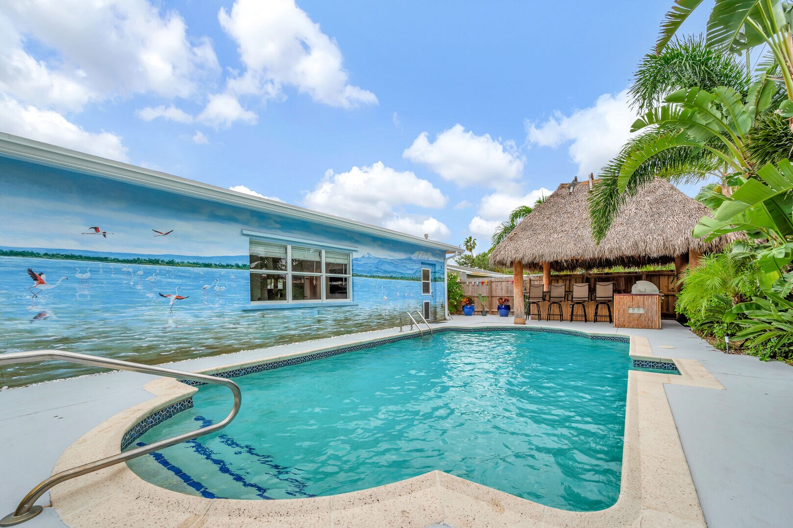 Heated pool is a good size, with Tiki hut Bar/dining area