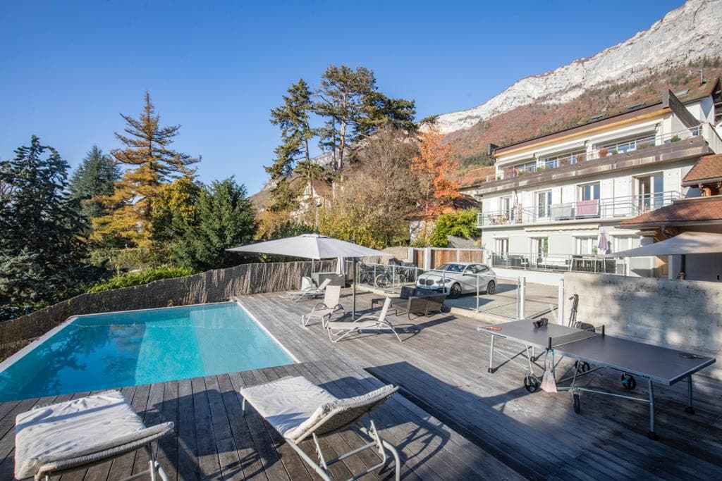 LLA Selections invite you to discover this outstanding apartment with private pool and amzing lake view in the village center of Veyrier du Lac, Lake Annecy 
