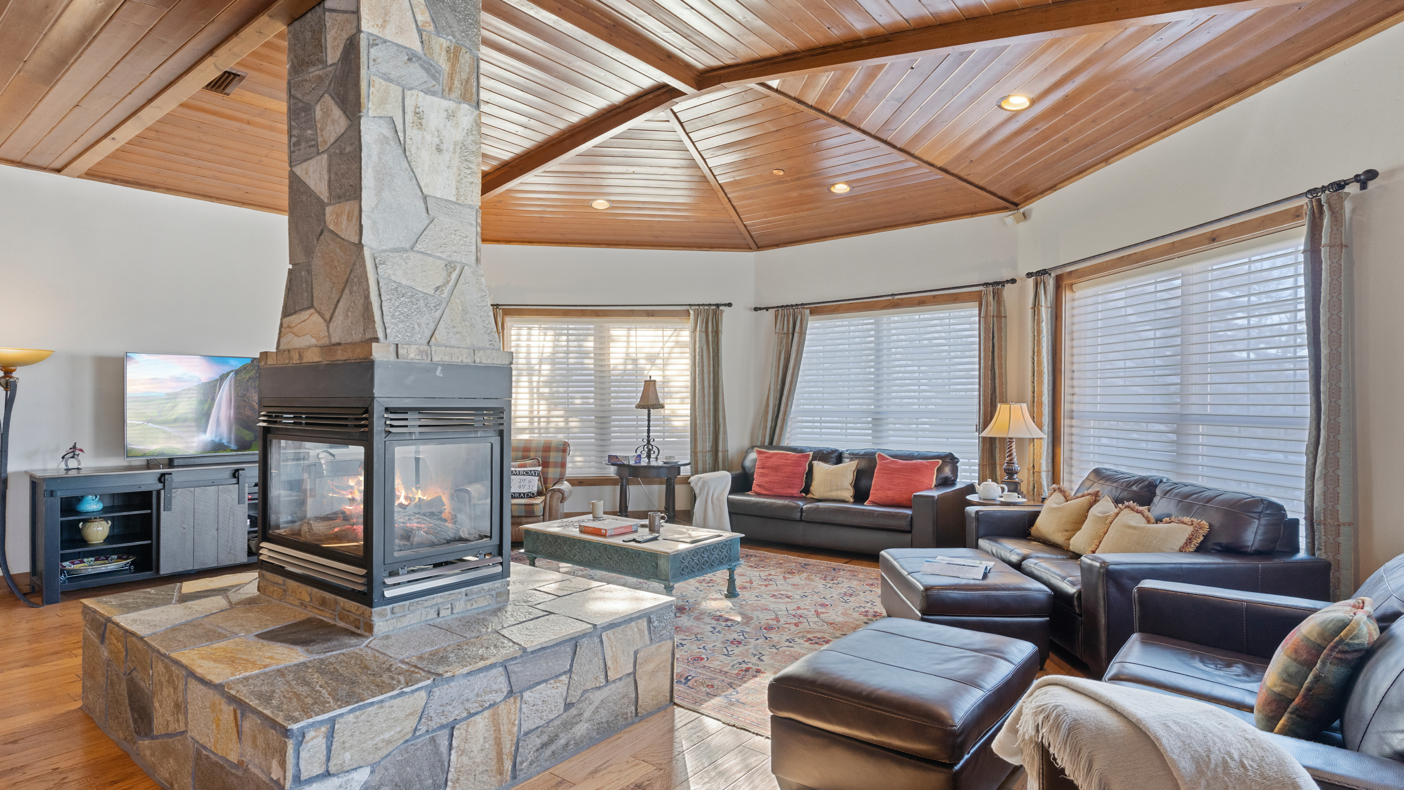 Great room with 4-sided fireplace and seating