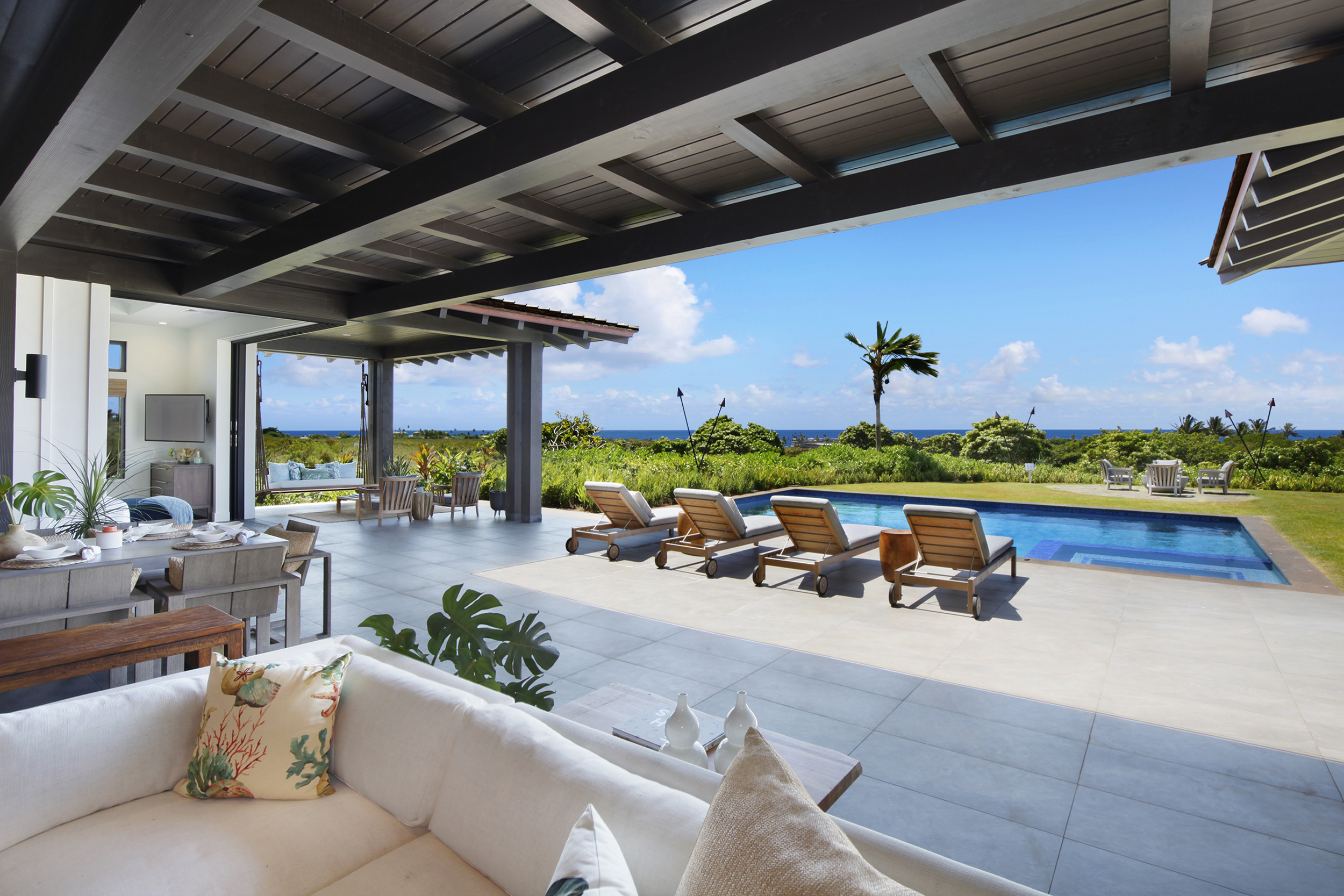 Outdoor living space and pool with ocean views