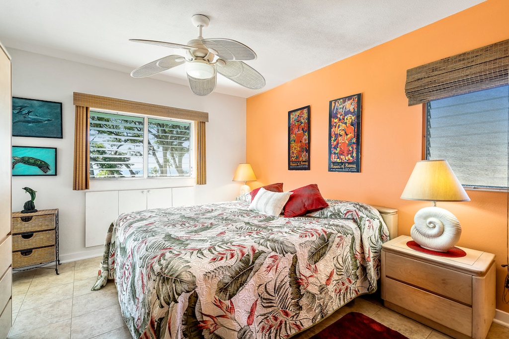 Bedroom featuring a King bed and TV with Ocean views