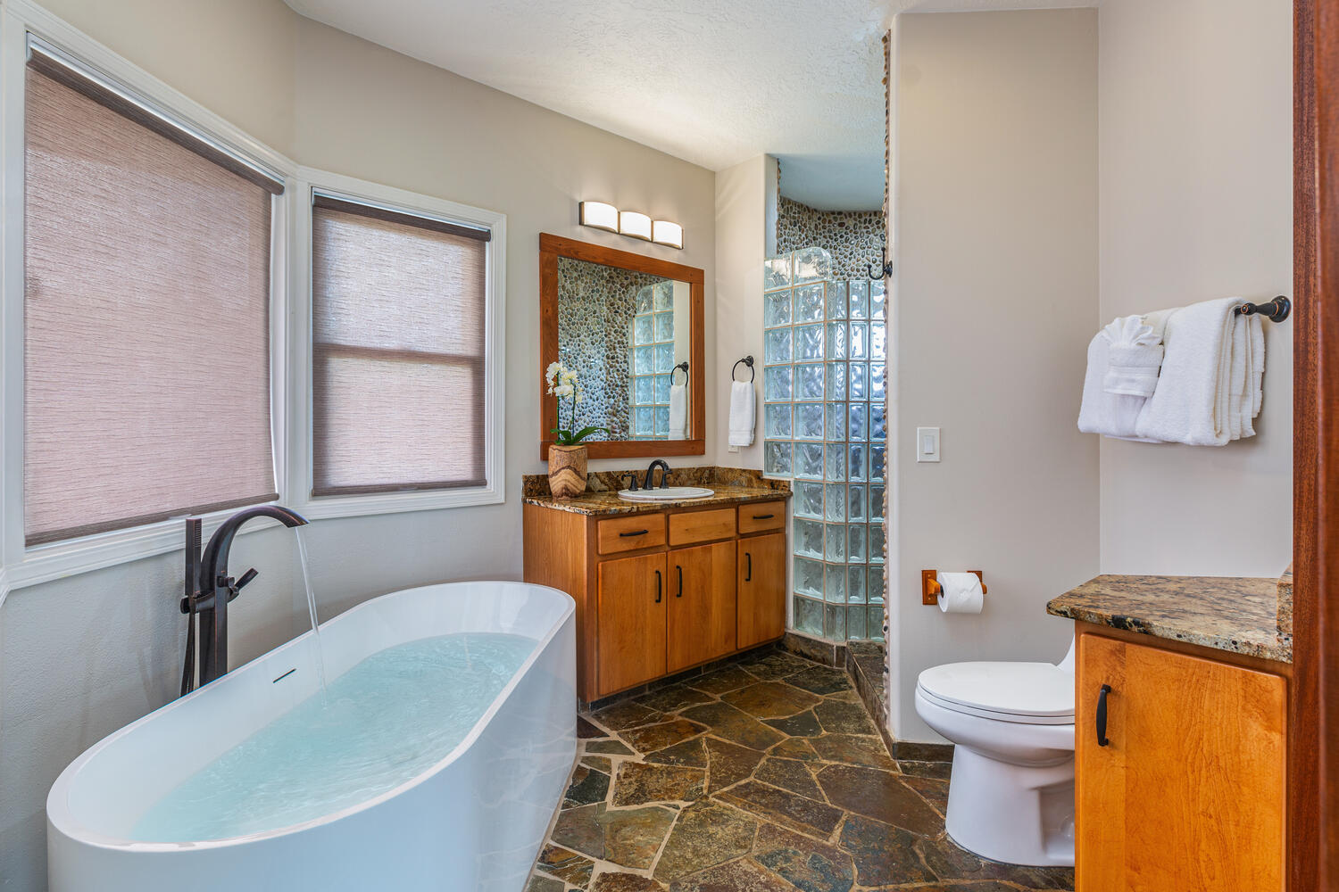 Soak up in the ensuite bathroom's large soaking tub with a view.