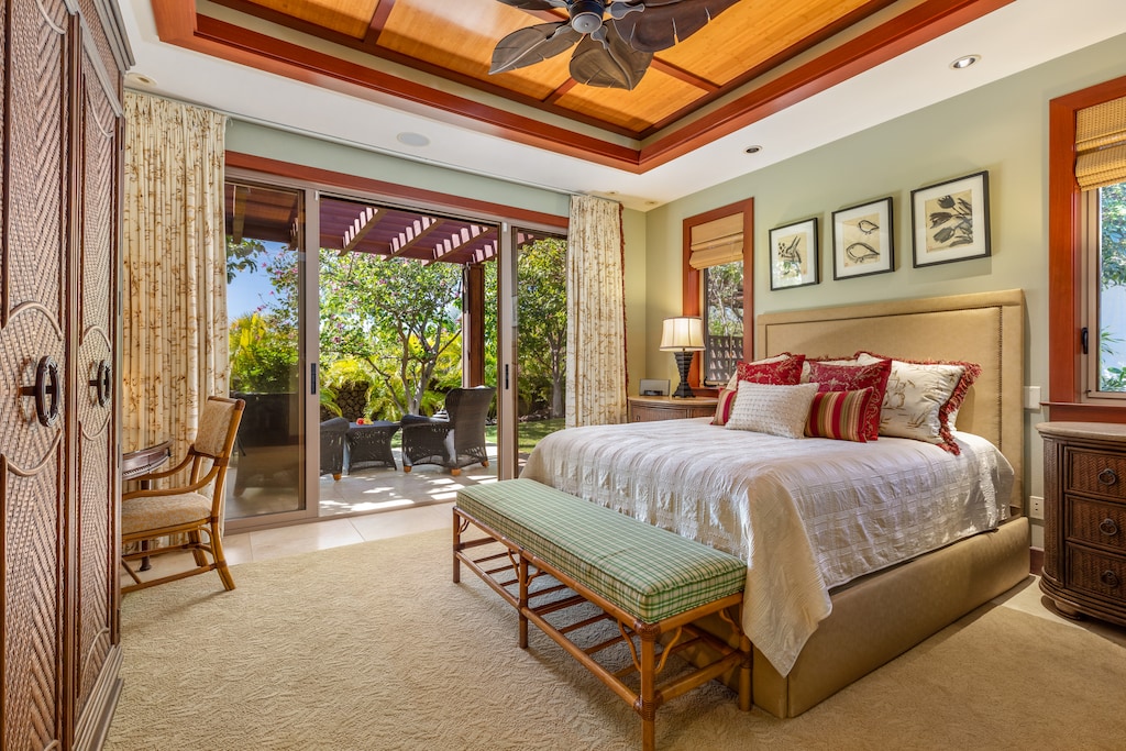 Unwind in this stylish guest suite offering king-size comfort, ceiling fan, and garden scenery.