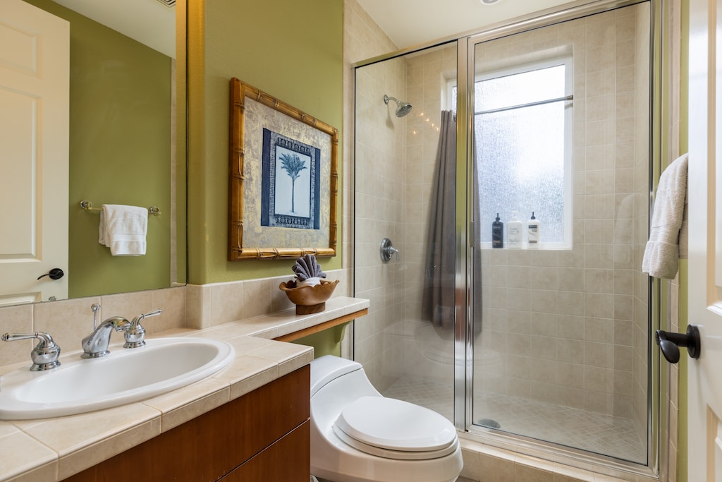 Conveniently located near the guest bedroom, the guest bathroom features a walk-in shower and modern finishes for a comfortable stay.