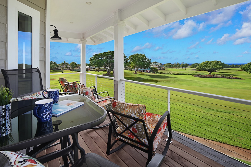 Lanai view overlooking vibrant greenery, perfect for enjoying a morning coffee or an evening glass of wine.