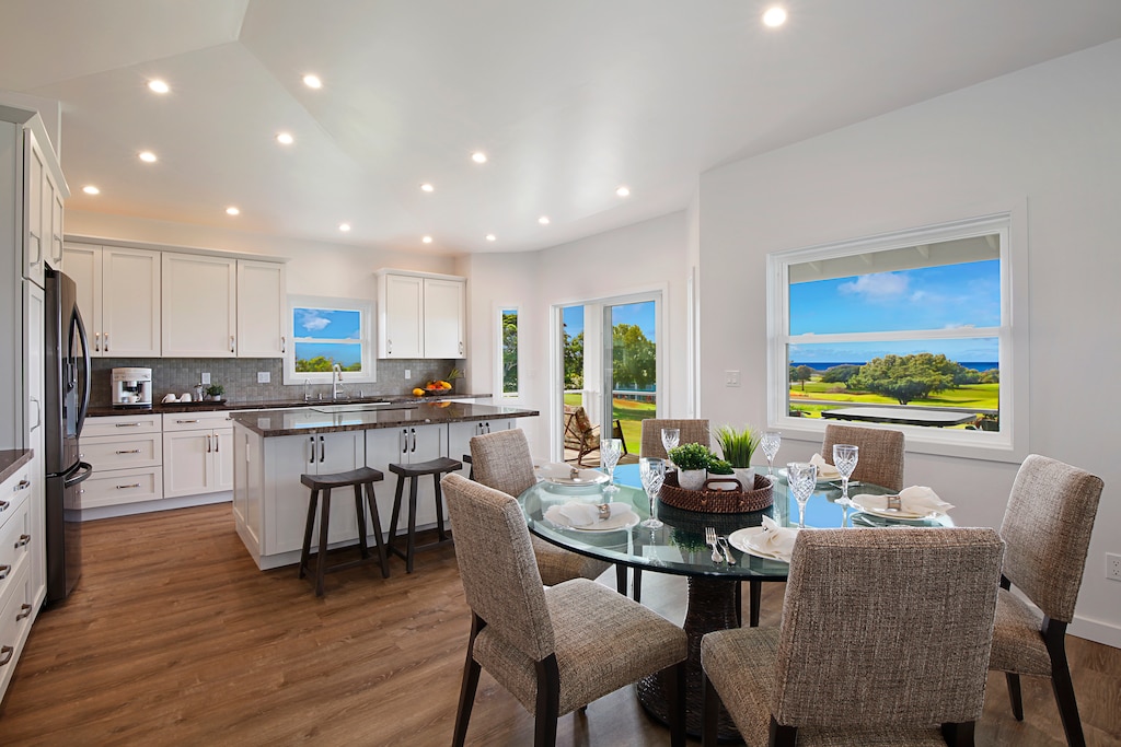 Open dining and living area offering a seamless flow for family gatherings and relaxation, complemented by stunning views.