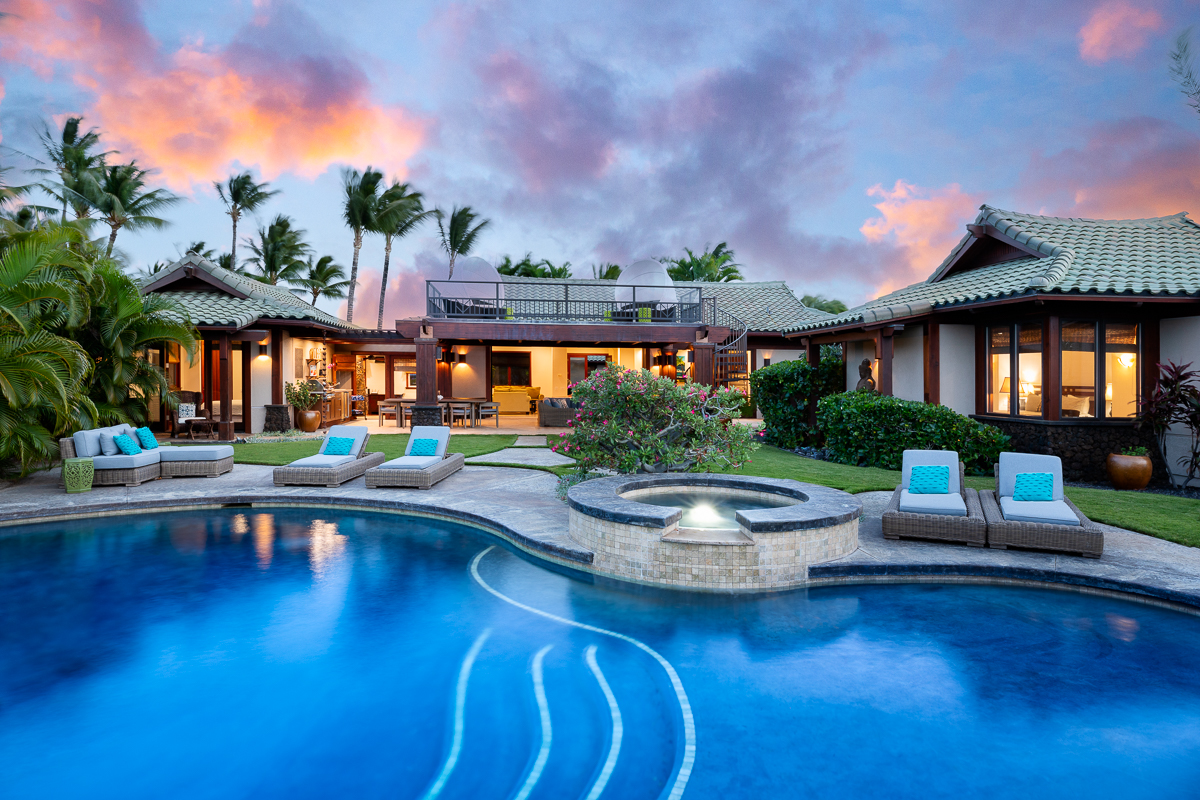 Take a refreshing dip in the pool in this sprawling 3,500 square/ft retreat offers four spacious bedrooms and 360-degree panoramic views of the ocean, golf course, volcanic mountains.