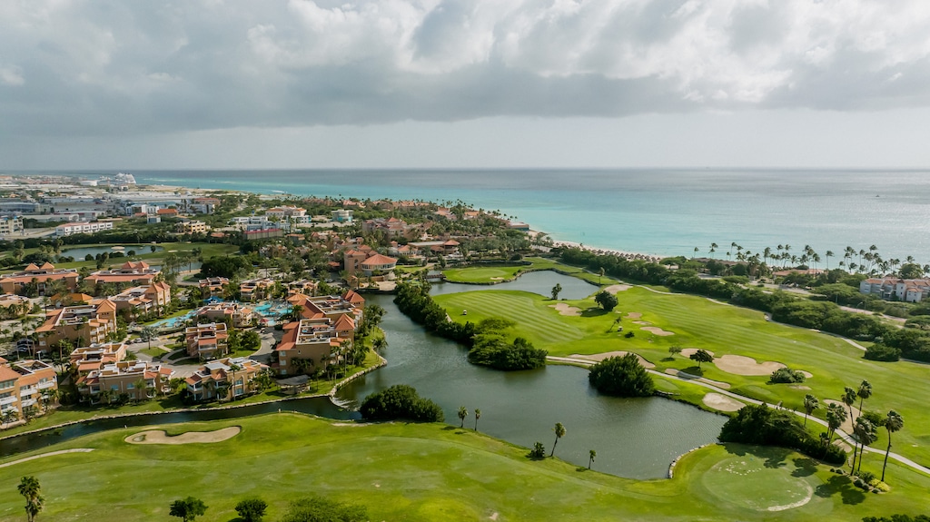 Immerse yourself in the serenity of Divi Village's picturesque golf course, where each swing is met with stunning views and a sense of tranquility.
