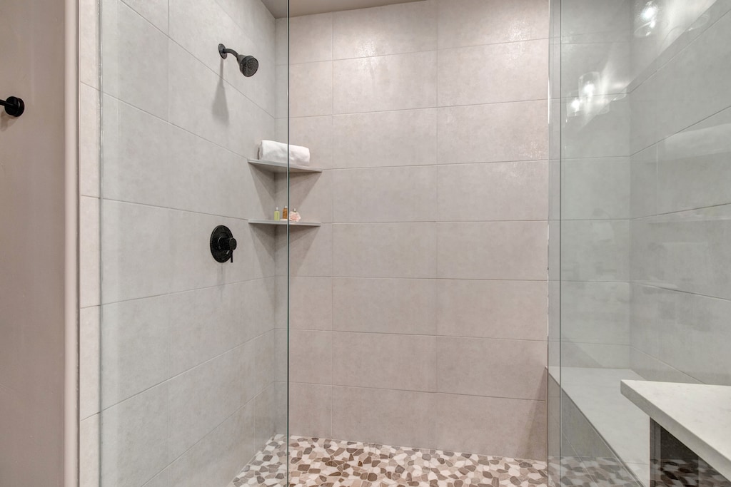 Master Bath with a Tile / Glass Shower