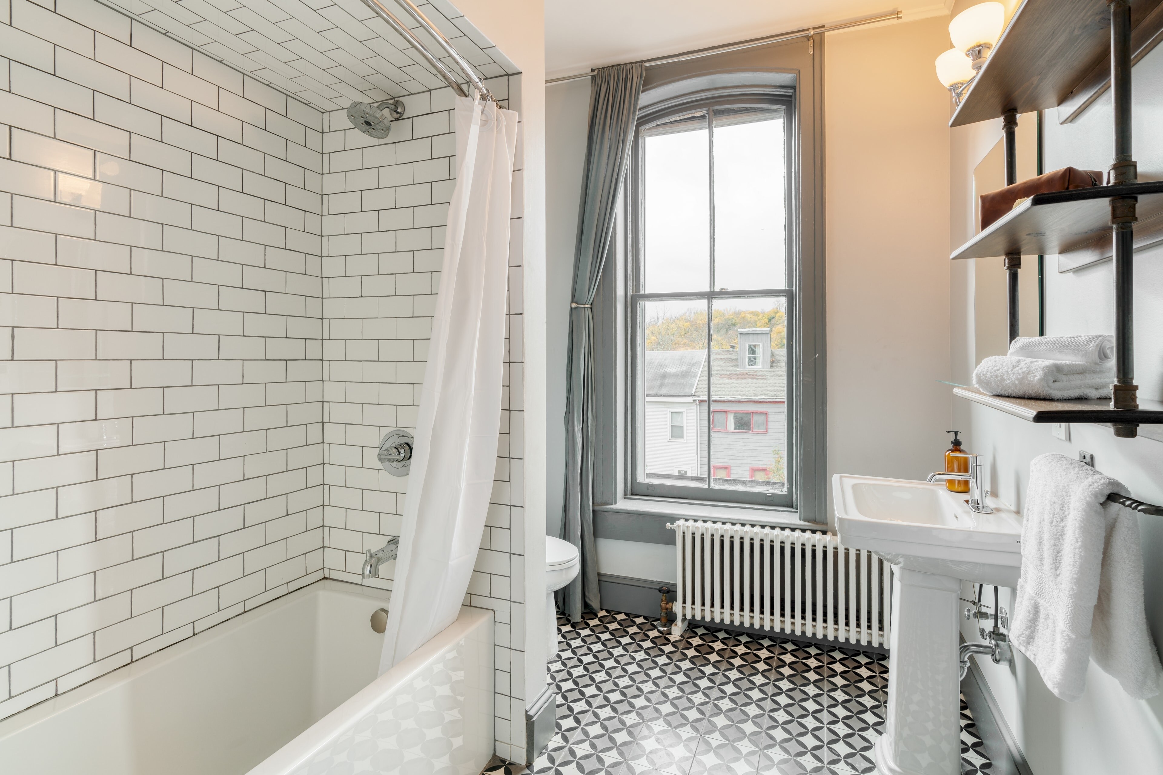 Bathroom 2 features a shower/tub combo.