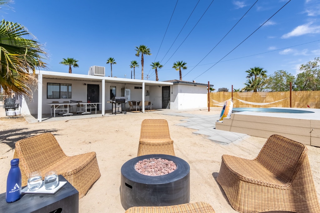 Patio features comfortable seating and a ping-pong table.