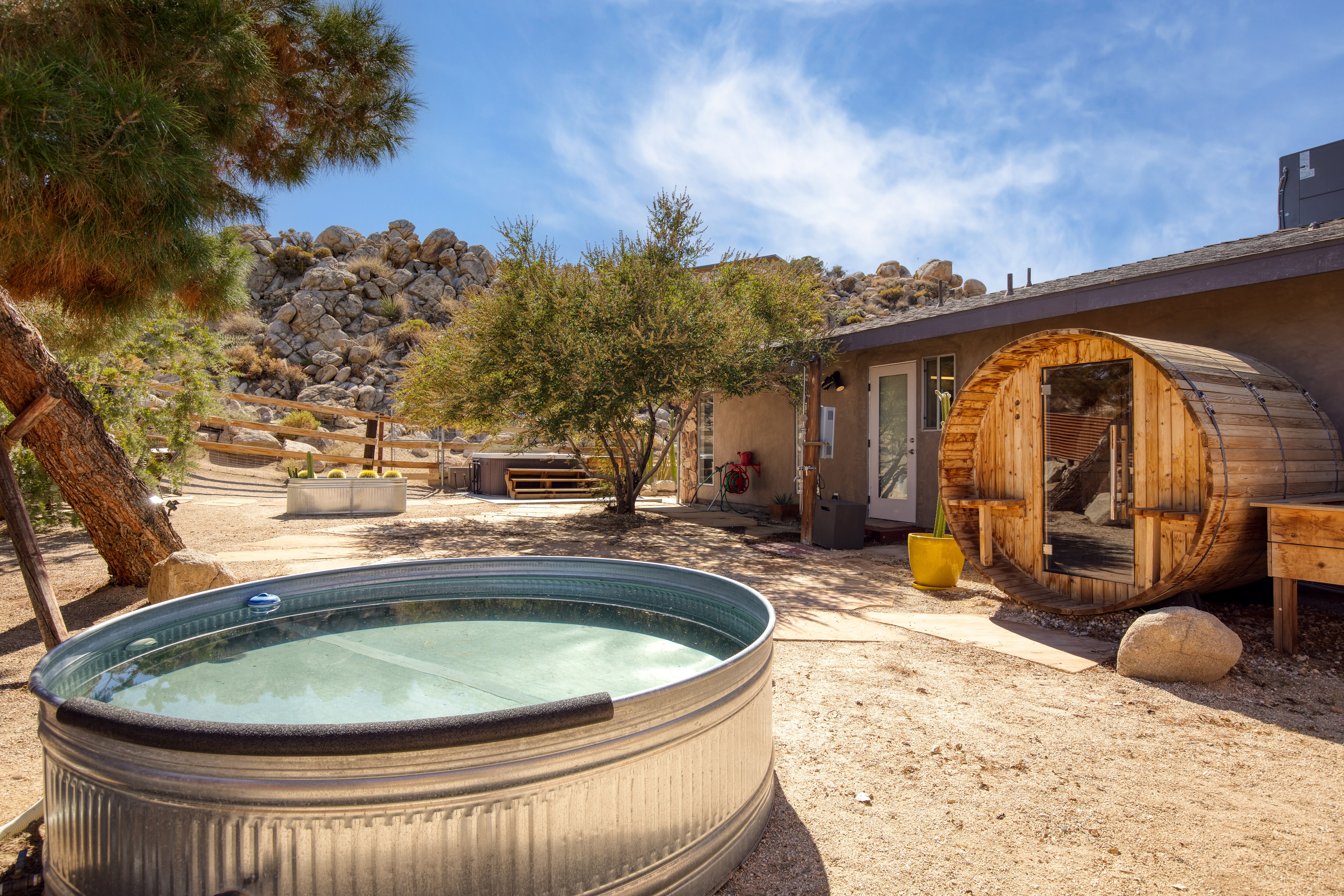 Stunning Joshua Tree escape with tons of amenities, including a stock tank pool and sauna!