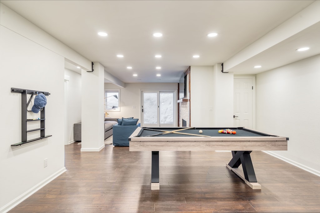 Downstairs living area with pool table and TV.