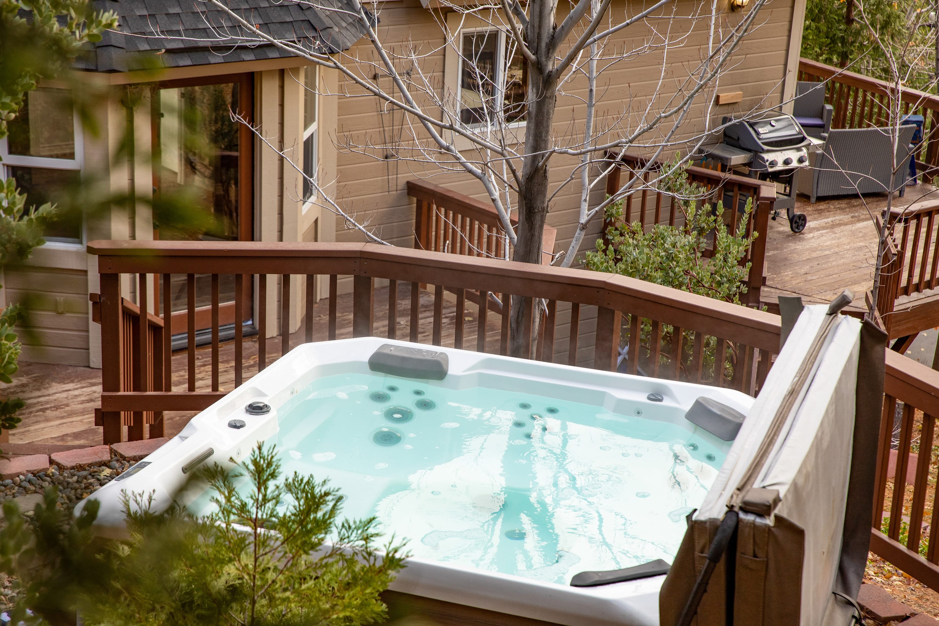 Spacious deck are with a private hot tub.