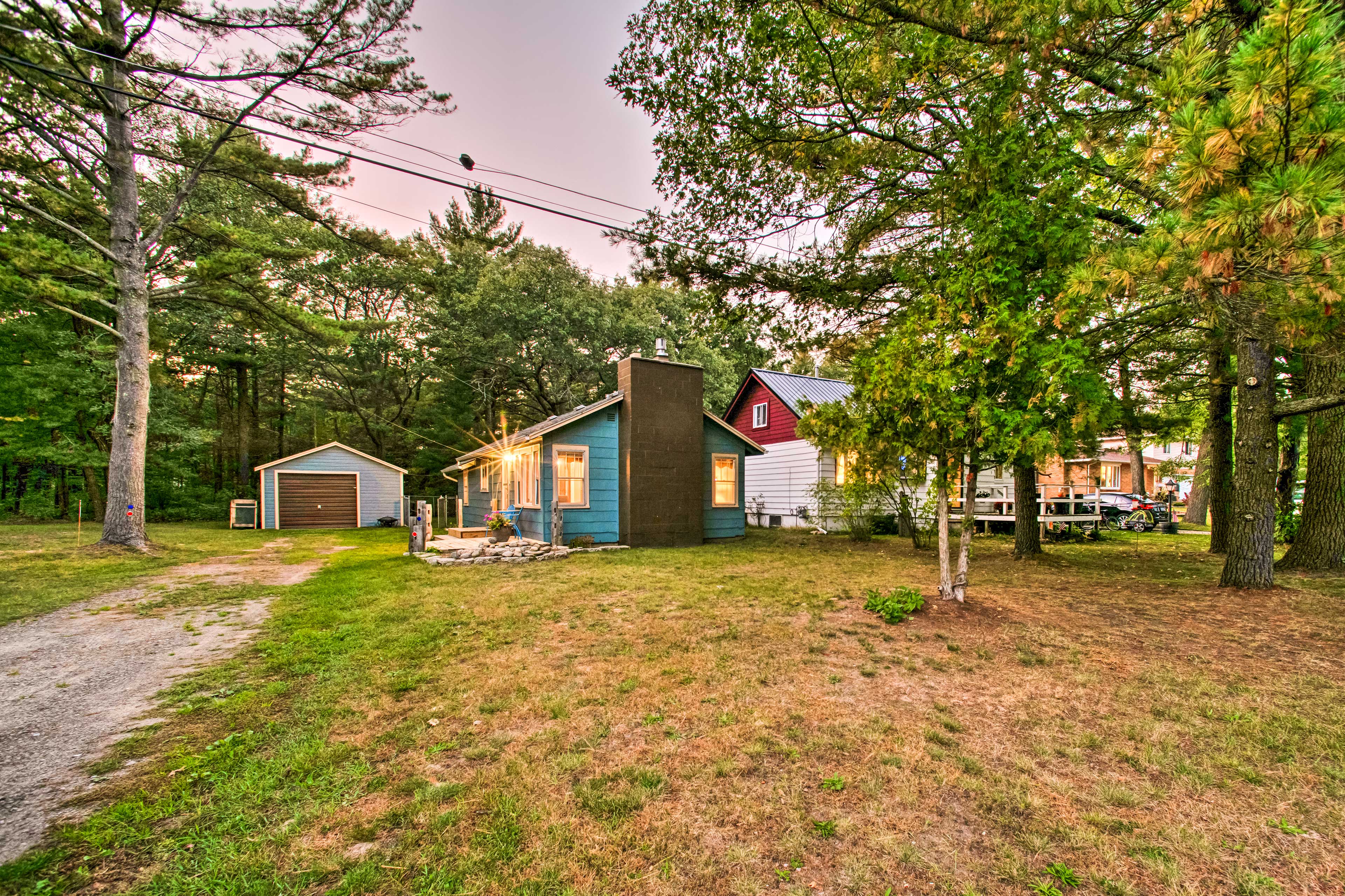 Property Image 1 - East Tawas Cabin w/ Deck, Backyard & Fire Pit!