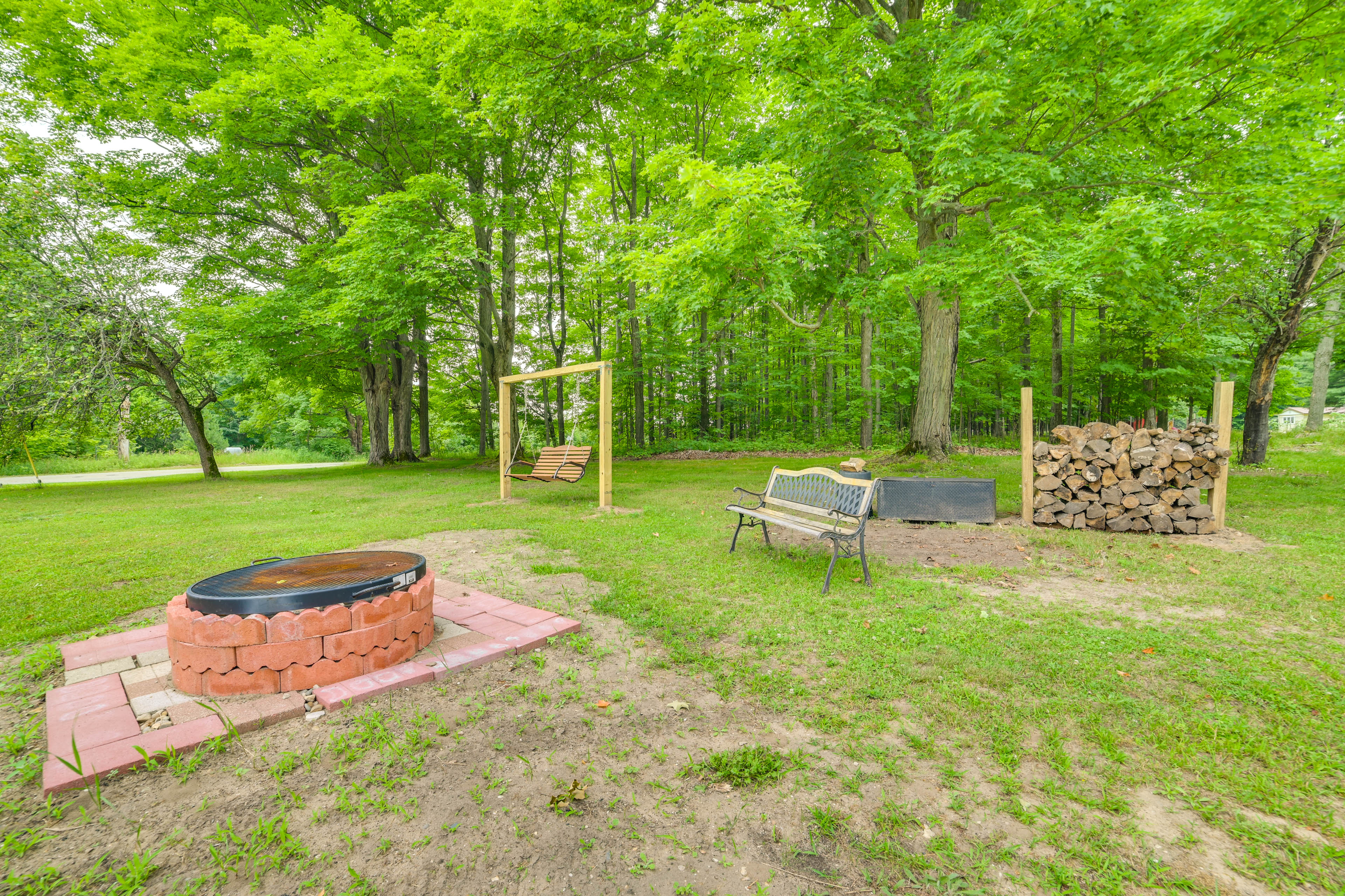 Property Image 2 - Fife Lake Farmhouse w/ Peaceful Yard & Fire Pit!