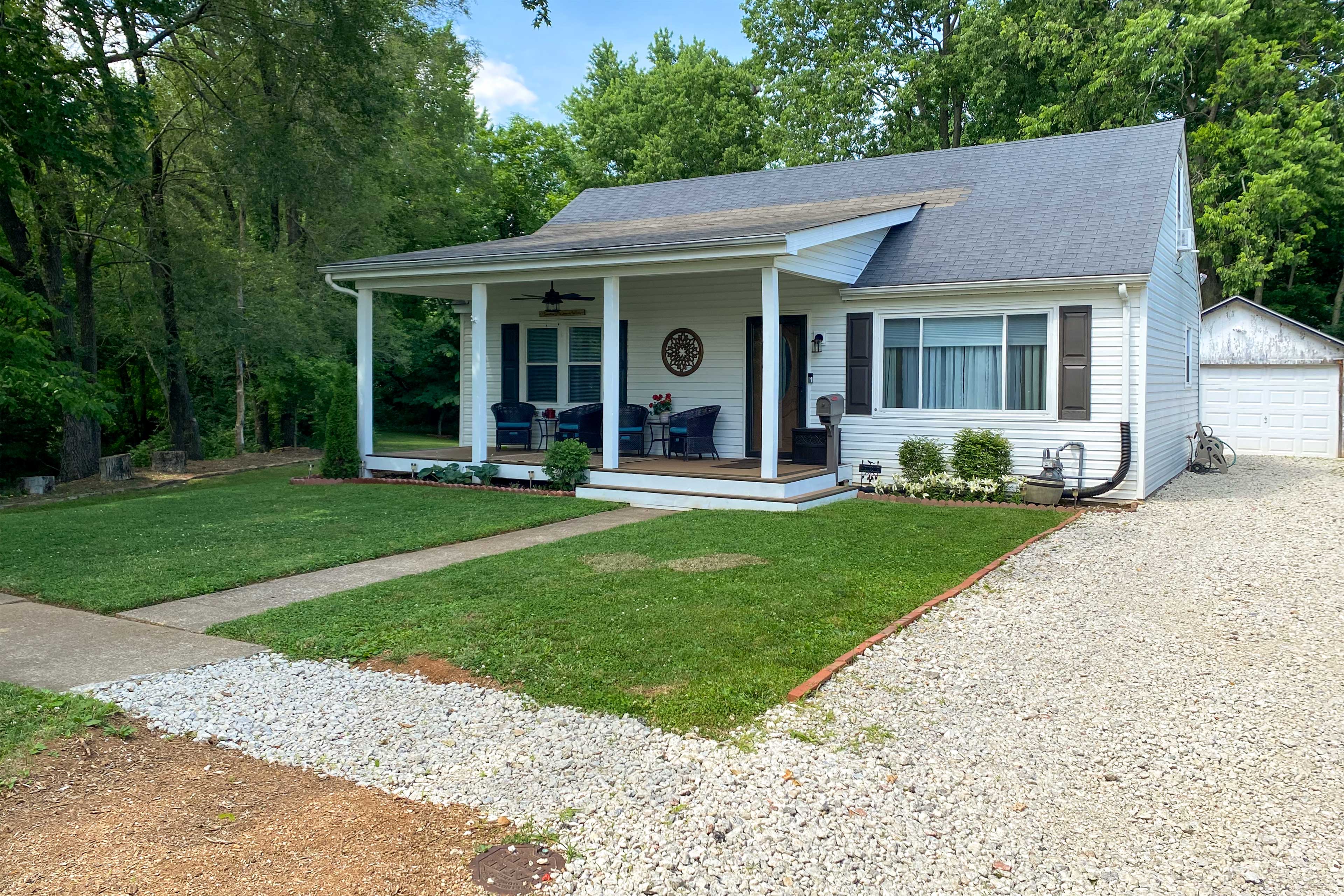 Property Image 1 - Quaint Creekside Cottage w/ Porch & Backyard!