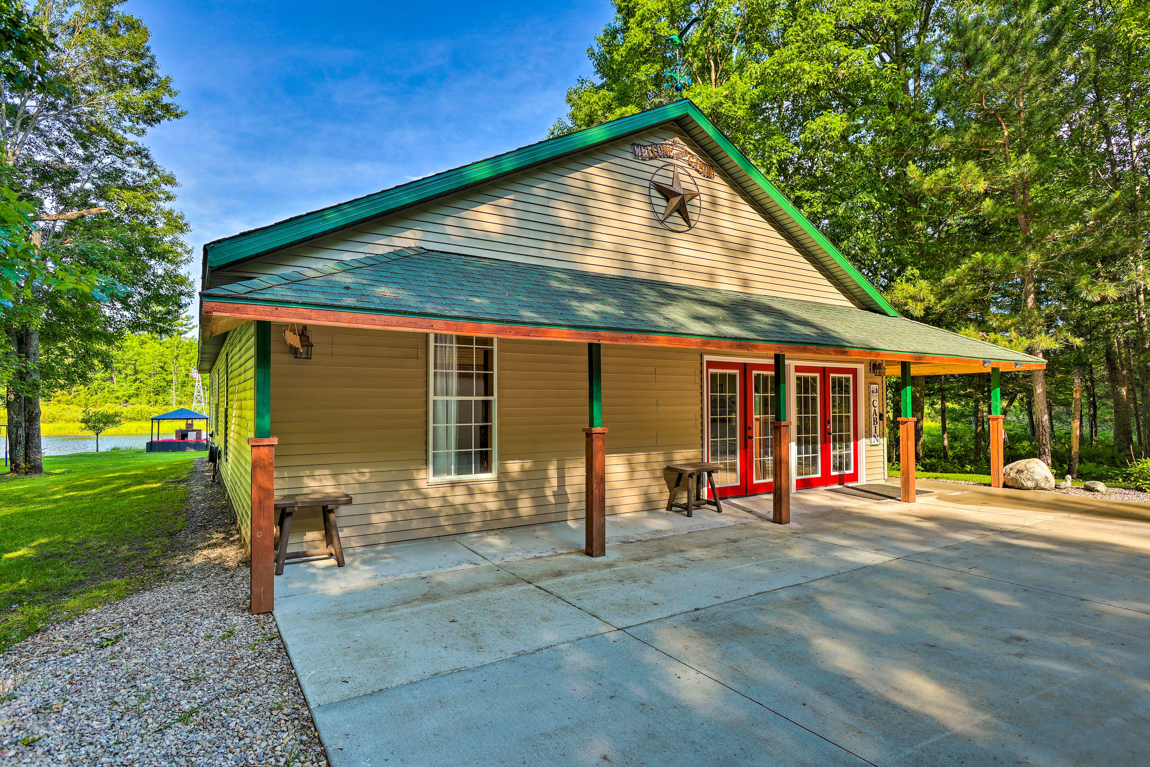 Property Image 2 - Sun-Dappled Cadillac Gem w/ Kayaks & Grill!