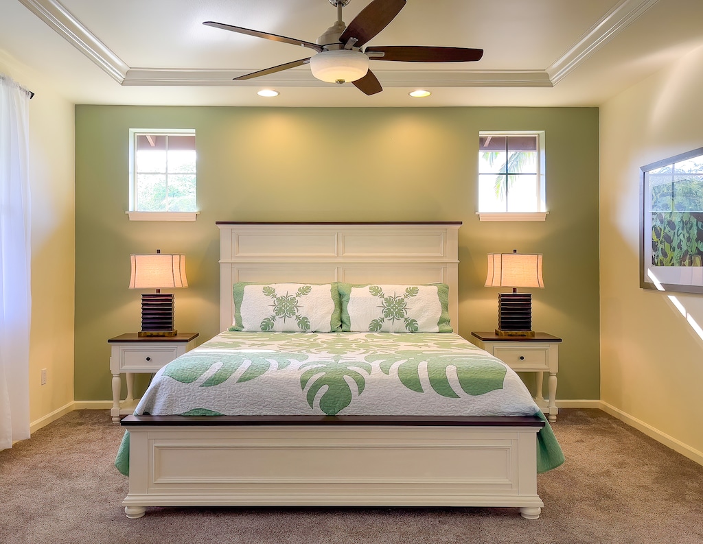 High ceilings, natural light, and elegant design make this primary suite the perfect setting for restful island nights.