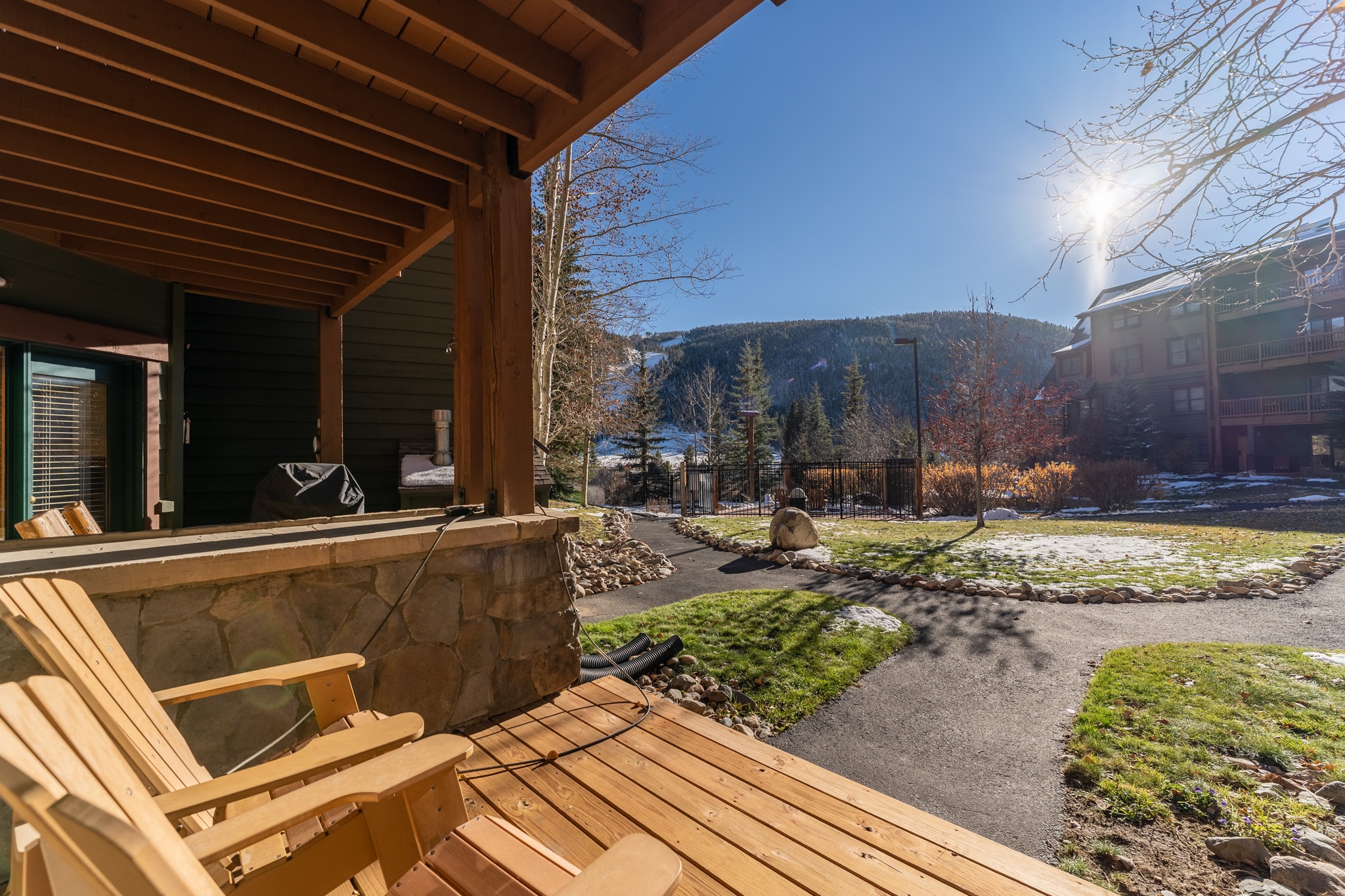 Private patio offering seating and mountain/ski slope views.