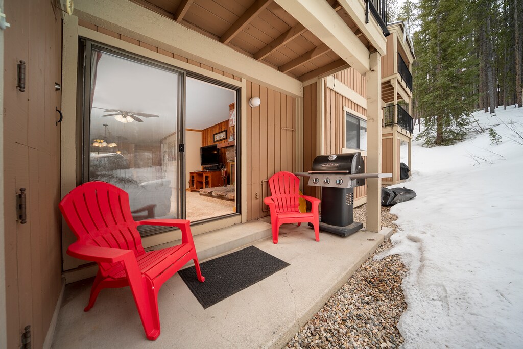 Your private patio offers cozy seating and a BBQ grill, perfect for enjoying fresh mountain air and winter views.
