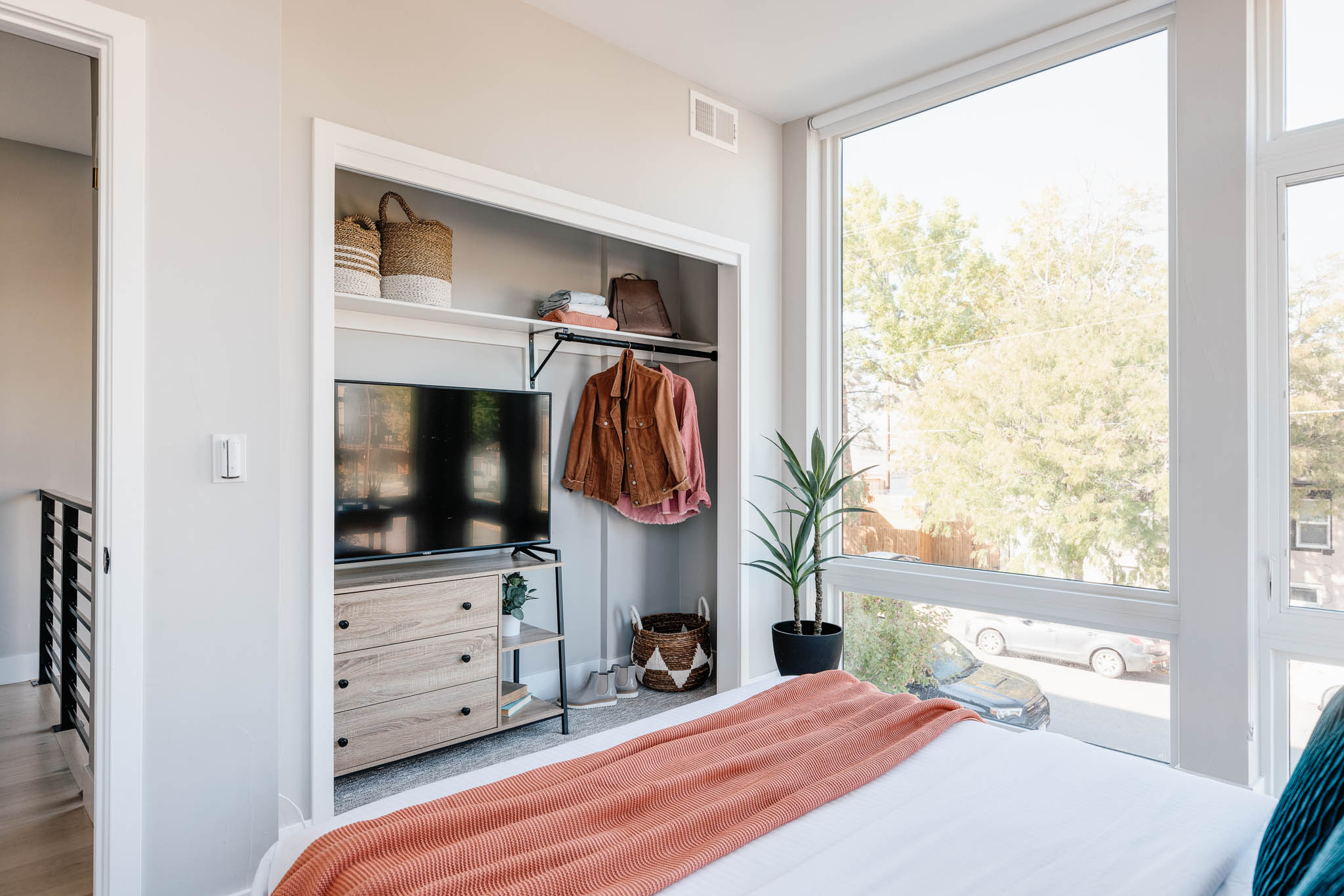 Queen bedroom 2 with TV and storage