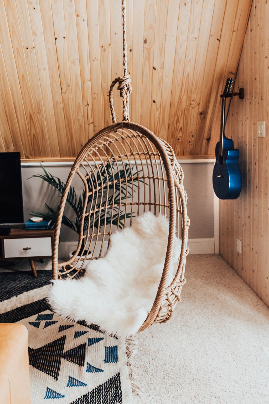 A relaxing egg chair hangs in the main living area