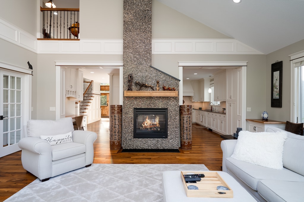 Stunning double sided gas fireplace makes this spacious room warm and cozy!