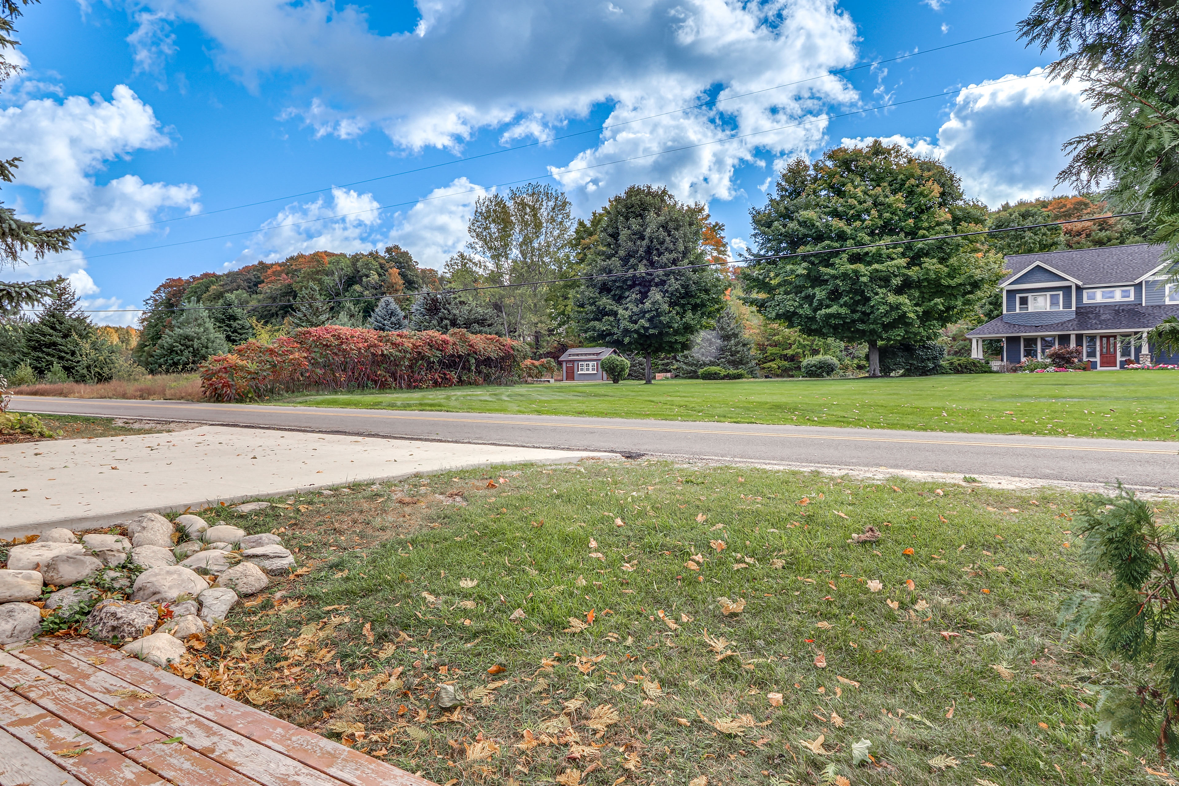 Property Image 1 - Waterfront Suttons Bay Cottage w/ Fire Pit!