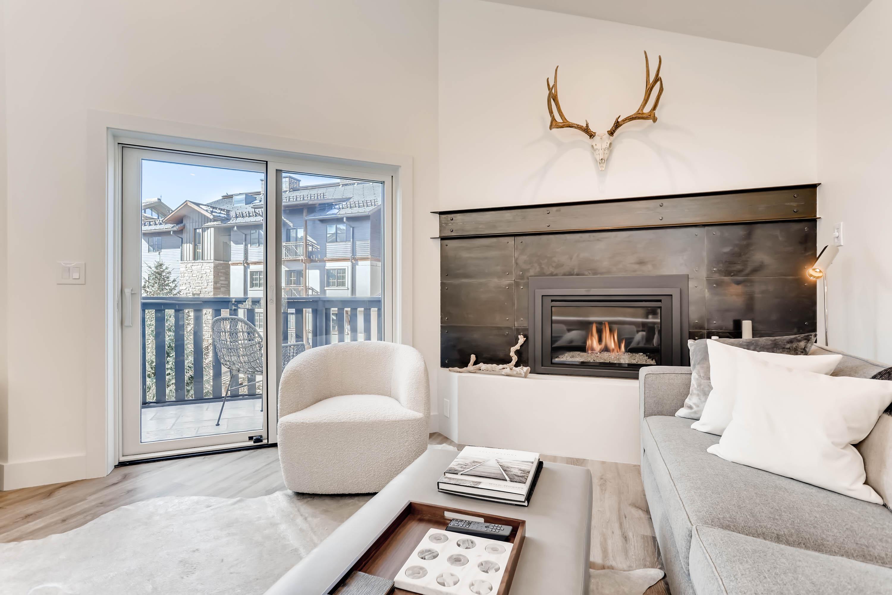Great views and beautiful fireplace in the open living area.