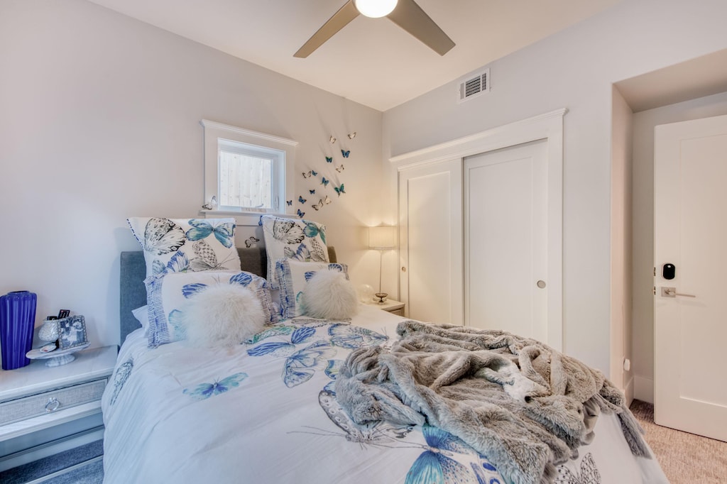 The guest bedroom continues the butterfly (papillon) theme.