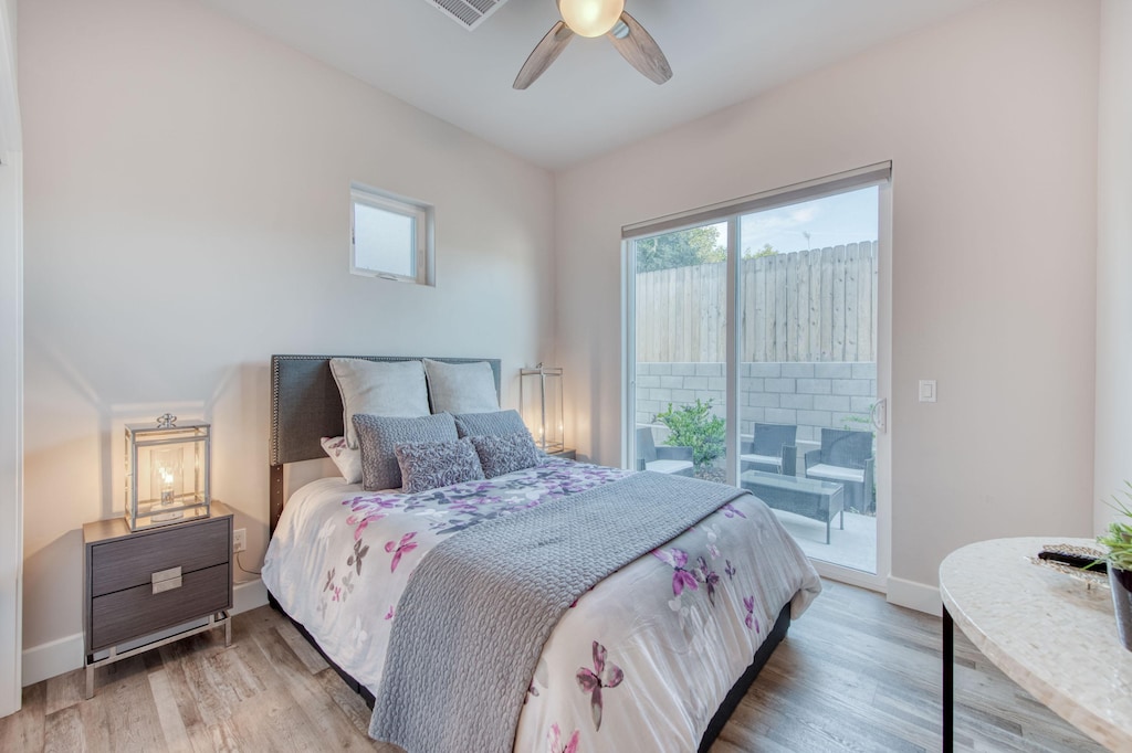 Guest bedroom with access to an outdoor deck.