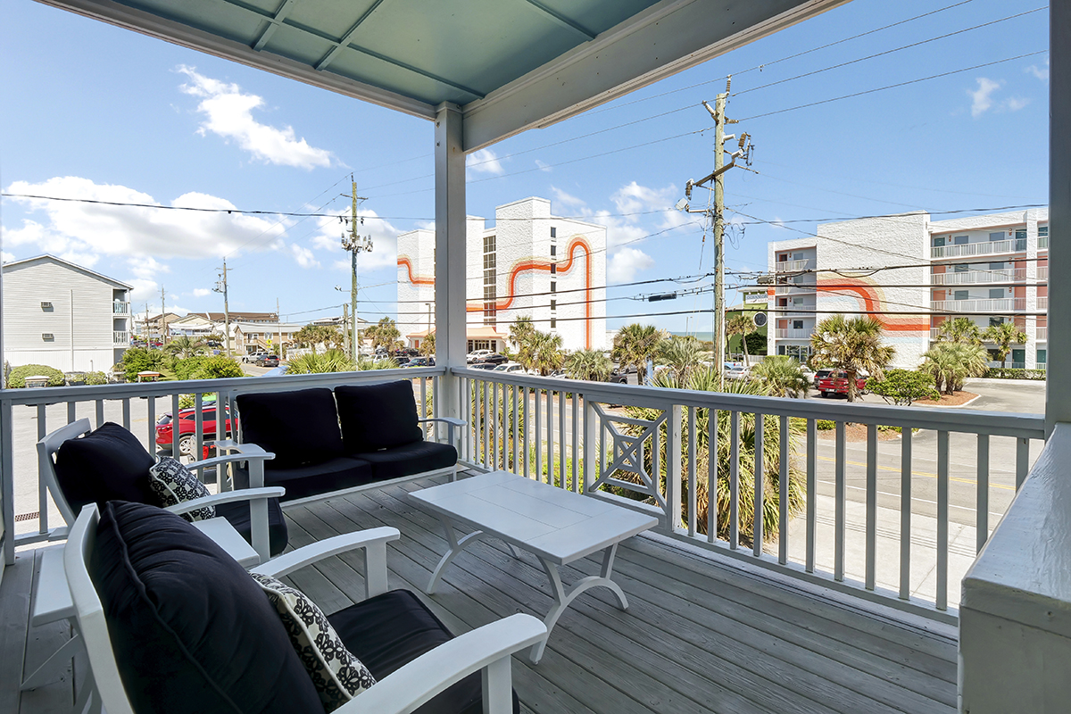 Feel the beach breeze from the front porch