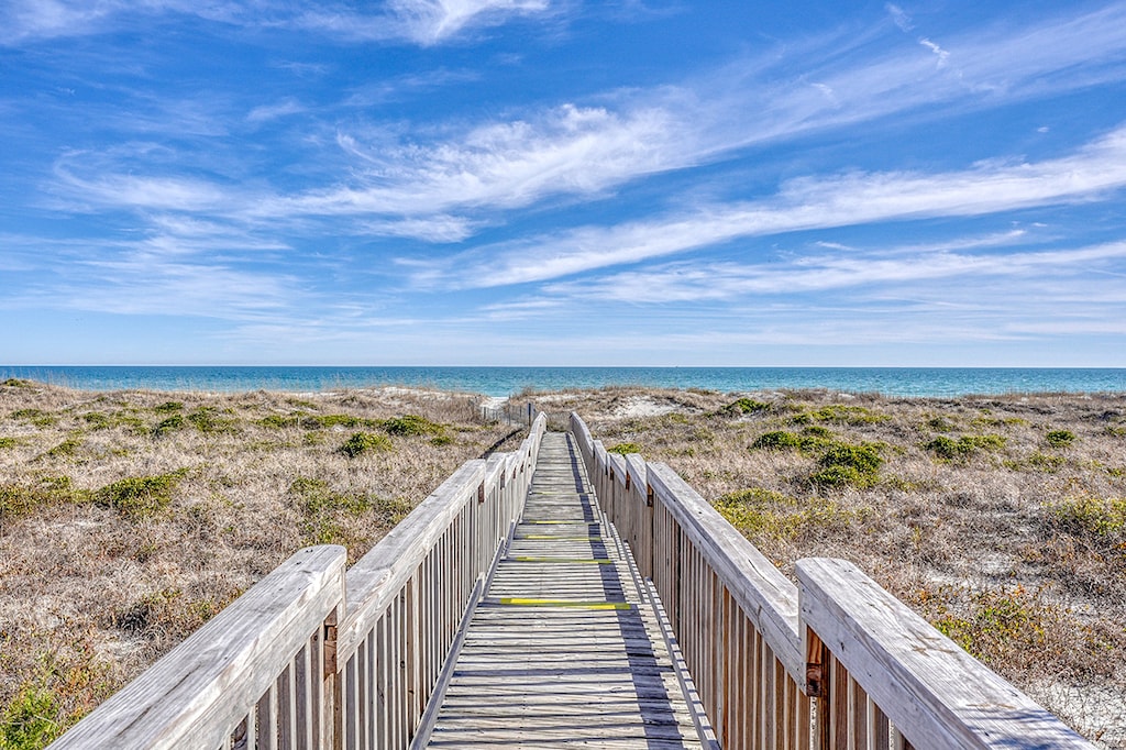 Savor the serenity of the dunes on your way to the beach
