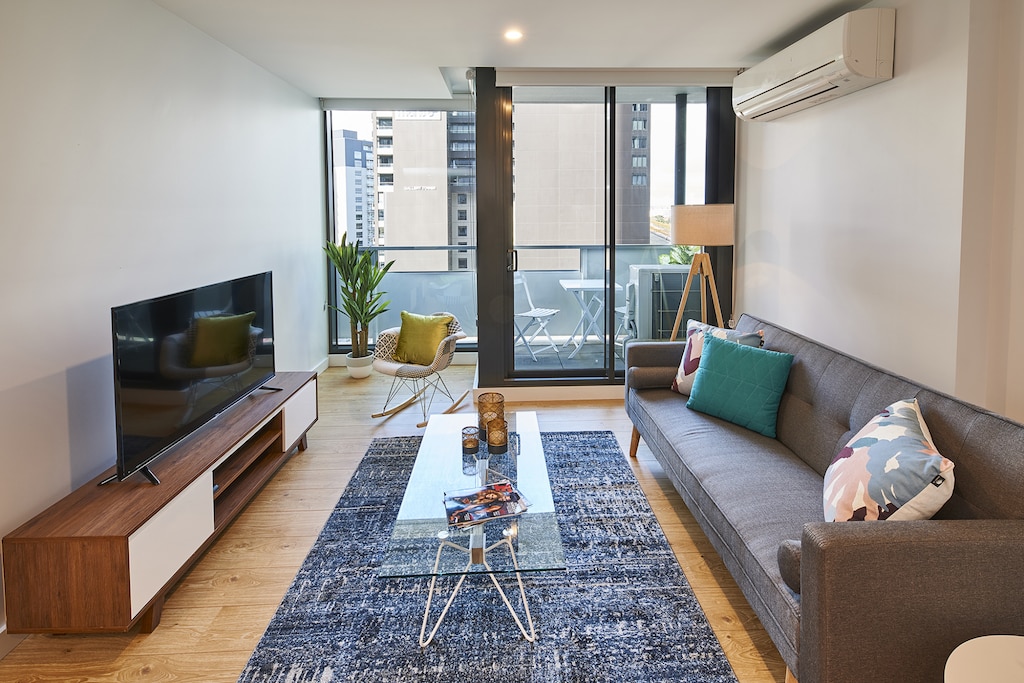 3 seater lounge with a 55" Smart TV