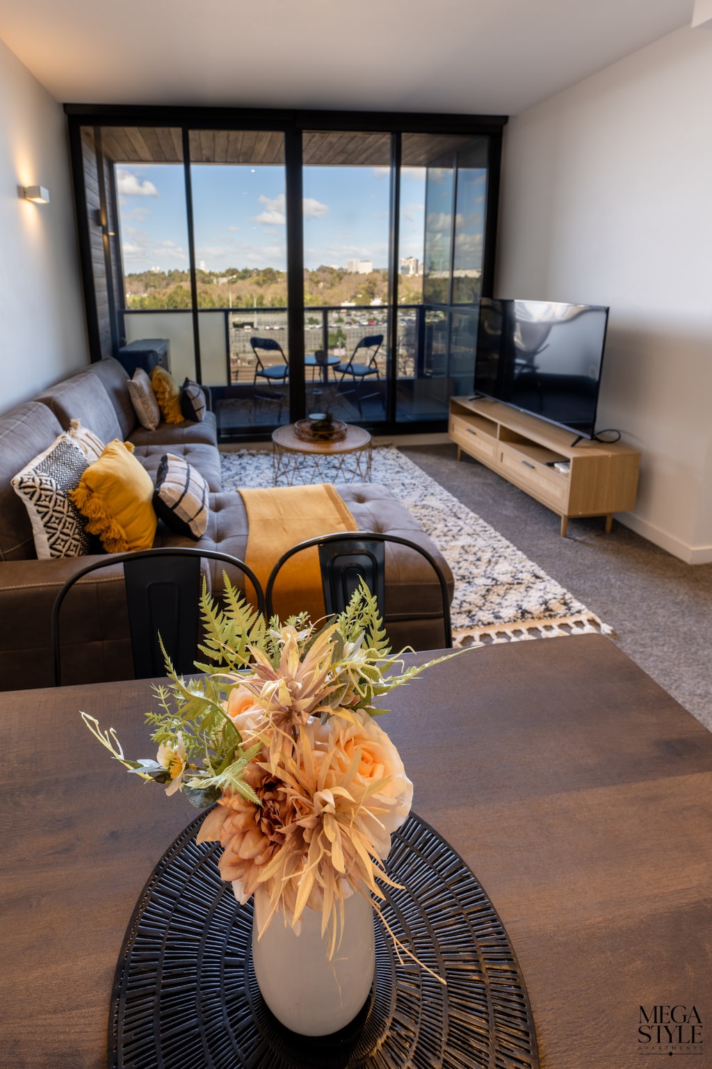 Relax in style on the luxe chaise lounge overlooking the city