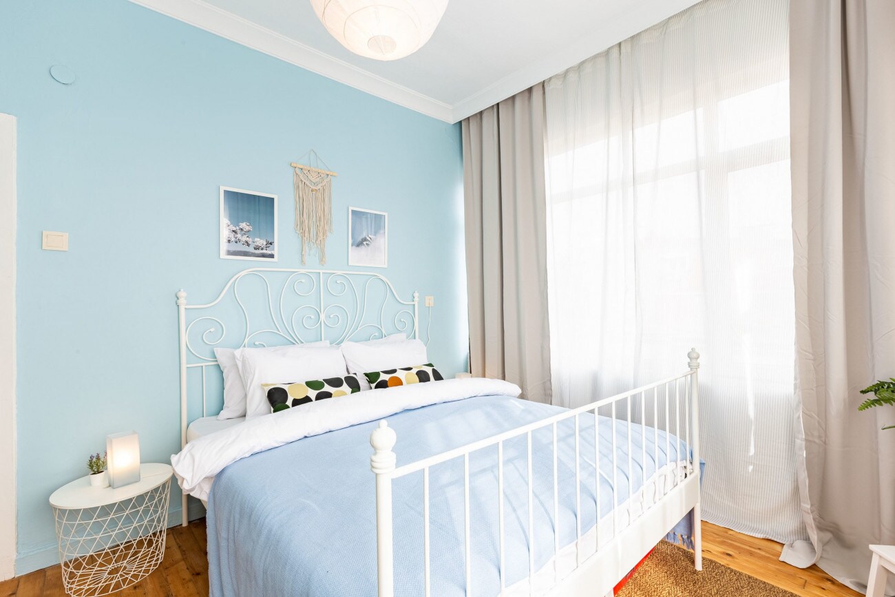 Our second bedroom has a more tranquil vibe with baby blue tones.