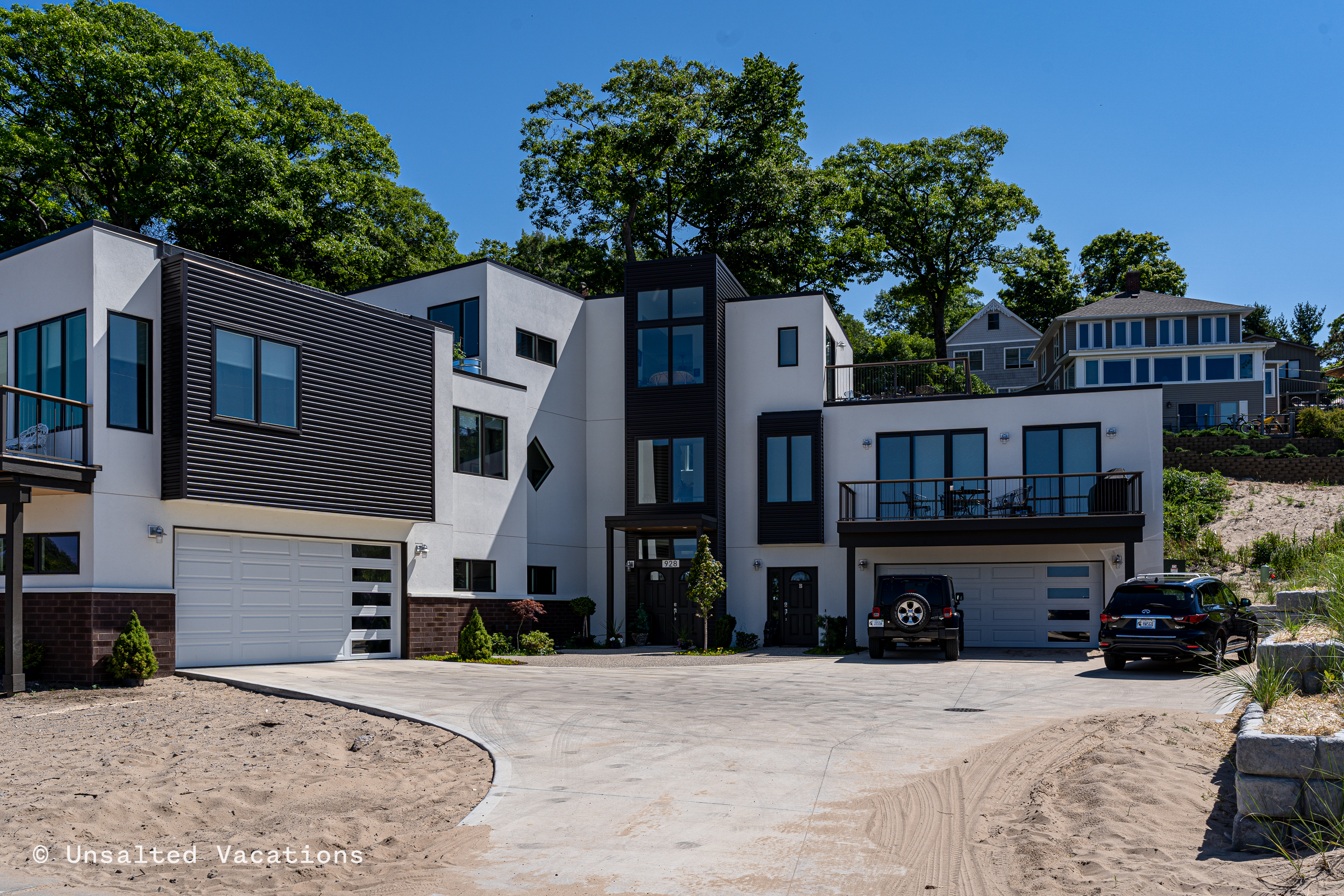 This brand new construction home has the best views of the Grand Haven Beach you can find!