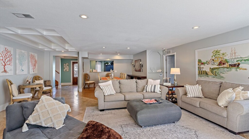 Living Room  - Living room with couch, love seat and chaise.