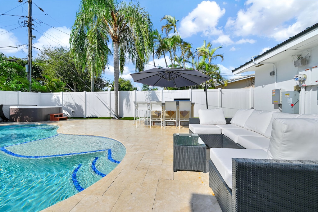 Heated Pool & Hot Tub with outdoor seating and dining area with BBQ