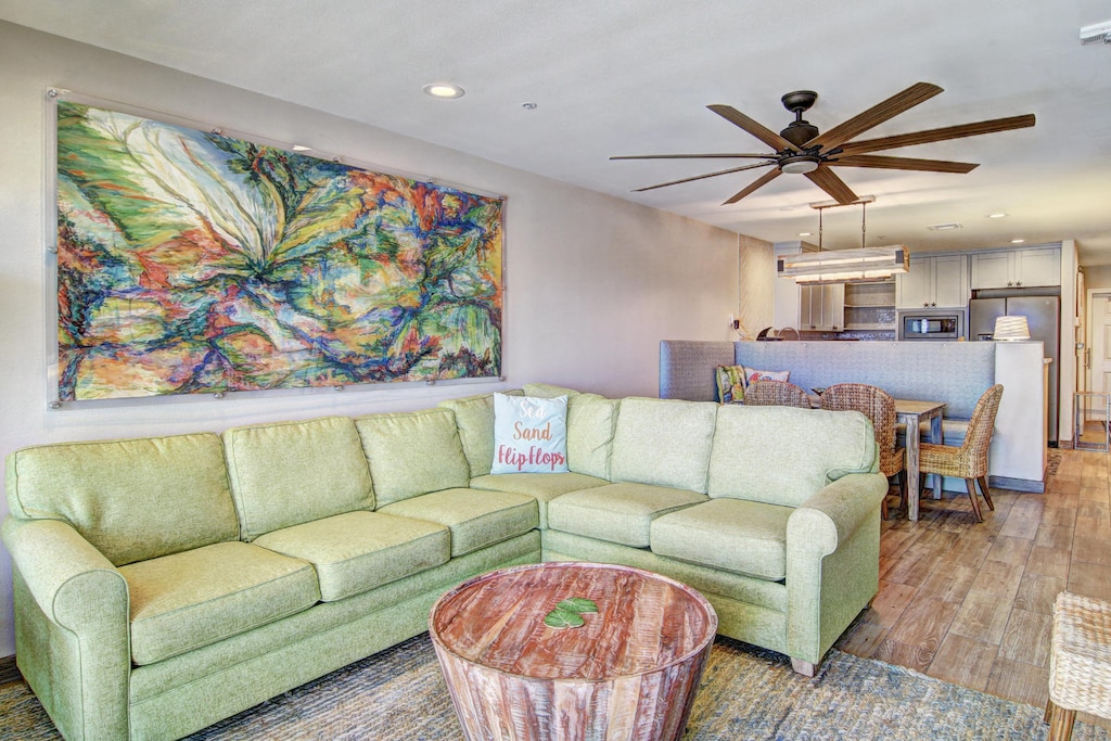 Open concept living area with modern furnishings and sleeper sofa