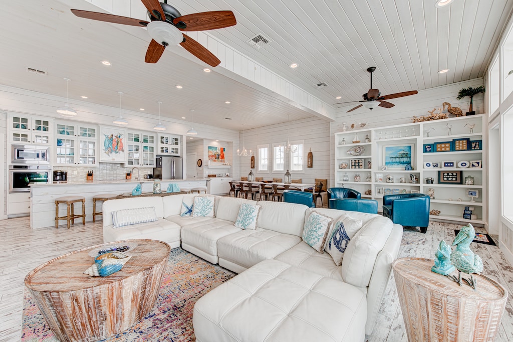 Living Area. Soft, comfortable seating, and ocean-inspired details create a welcoming space perfect for unwinding after a day by the shore.