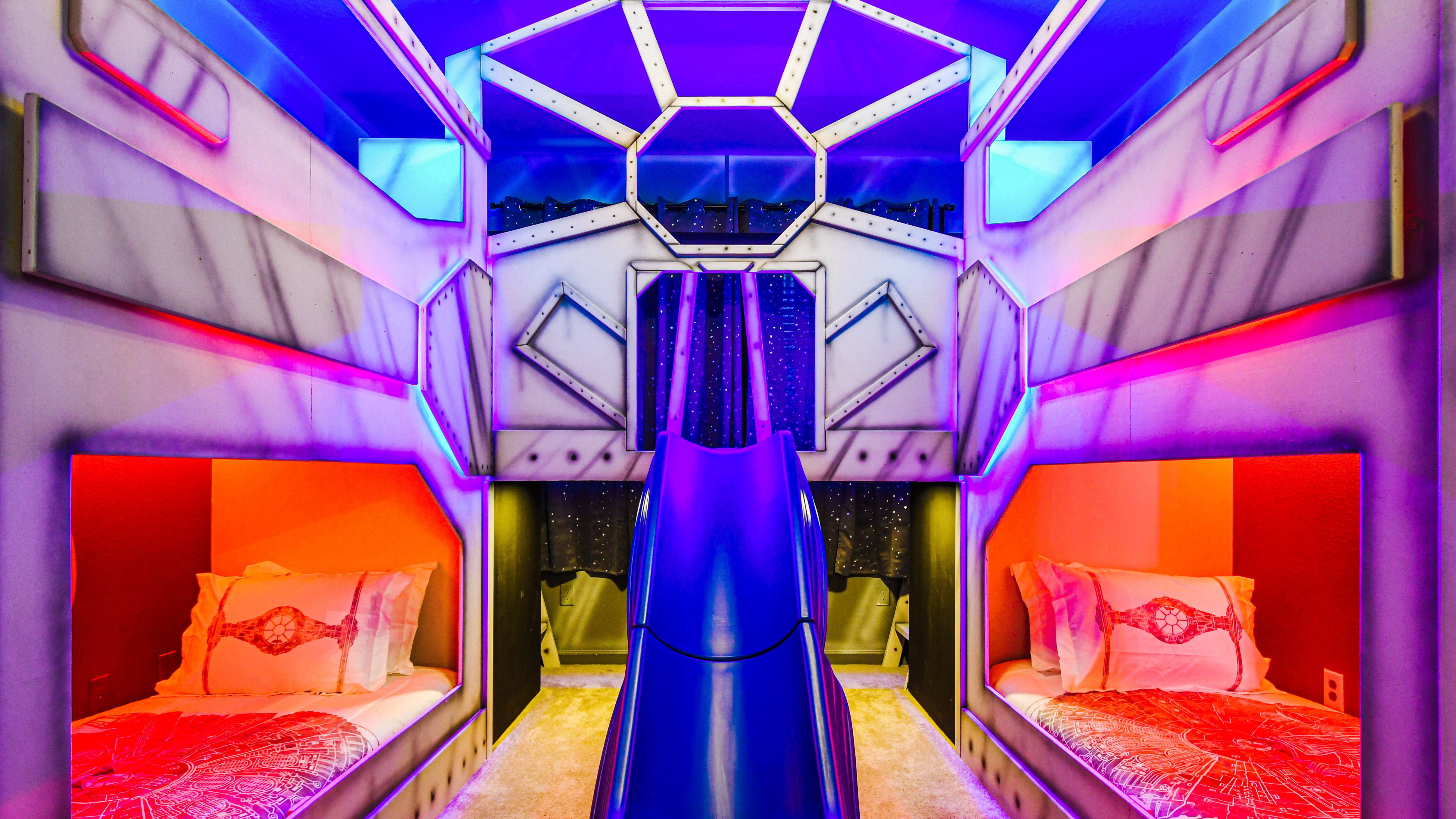 Ignite the spirit of adventure in the Star Wars-themed room featuring twin bunk beds