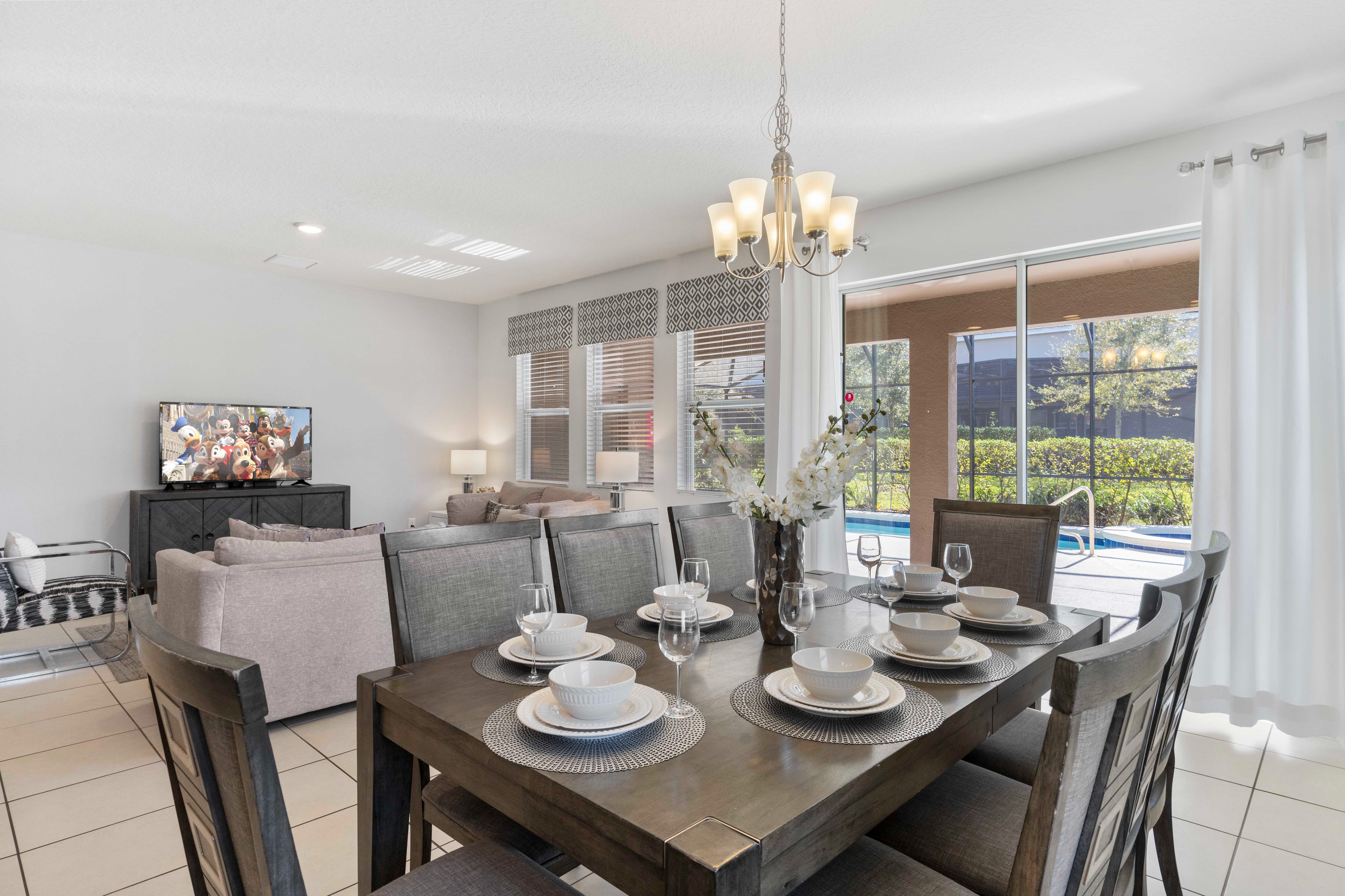 Chic dining area of the home in Davenport Florida - 8 Persons dining - Featuring a stylish table and contemporary seating -  Functional and aesthetically pleasing space - Open layout seamlessly connecting the dining area to the living area