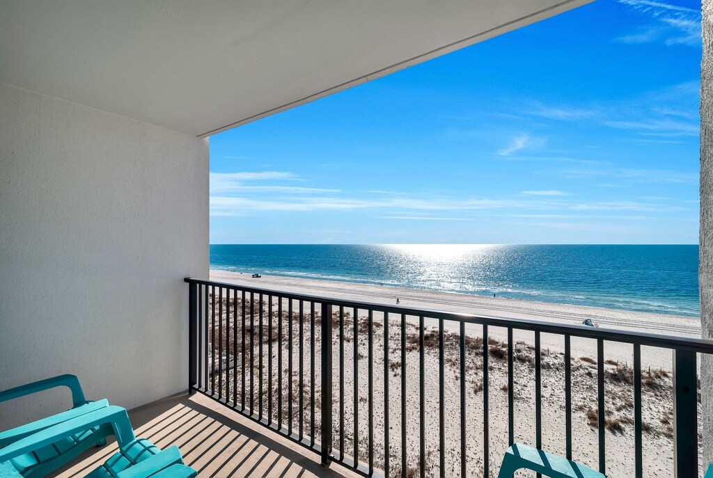 Relax on the Private Balcony overlooking the beach and the Gulf