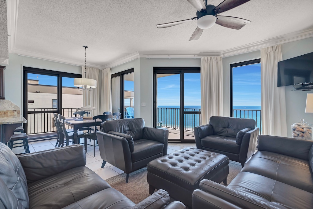 Spacious Open Plan Living Room with Plenty of Comfortable Seating, Sleeper Sofa, Flat Screen TV & DVD Player and Floor to Ceiling Views of the Gulf of Mexico 1
